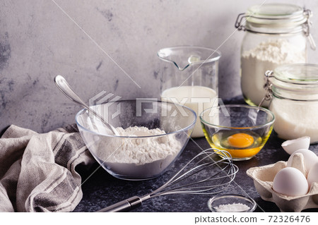 Cooking ingredients for dough, eggs, flour, sugar, milk. Cooking ingredients for dough, eggs, flour, sugar, milk. 72326476