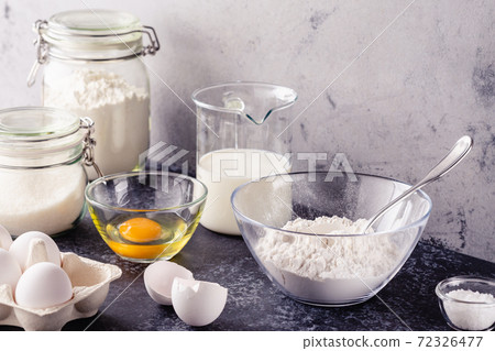 Cooking ingredients for dough, eggs, flour, sugar, milk. Cooking ingredients for dough, eggs, flour, sugar, milk. 72326477