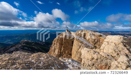 Hut on top of the mountain with snow 72326649