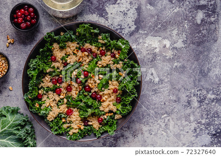 Healthy raw kale and quinoa salad with cranberry and pine nut. 72327640