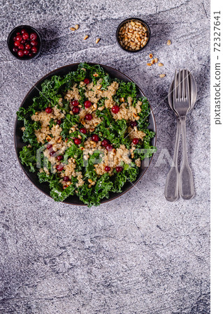 Healthy raw kale and quinoa salad with cranberry and pine nut. Healthy raw kale and quinoa salad with cranberry and pine nut. 72327641