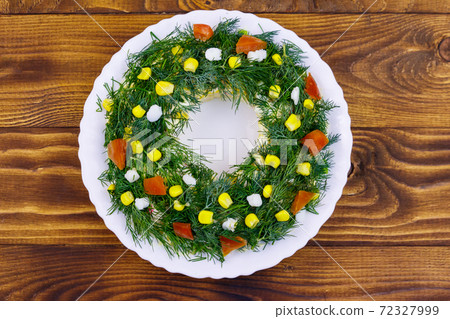 Salad Christmas wreath on a wooden table. Top view Salad Christmas wreath on a wooden table. Top view 72327999