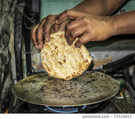 Baking national cakes Puri on the island of Sri Lanka Baking national cakes Puri on the island of Sri Lanka 72329051