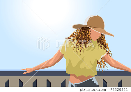 Woman in sun hat , yellow cropped t-shirt and jeans posing on the balcony Woman in sun hat , yellow cropped t-shirt and jeans posing on the balcony 72329321