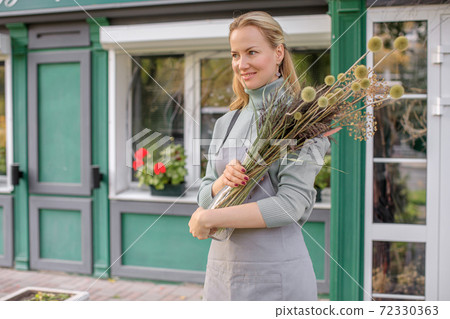 Floristry concept. bouquet of beautiful flowers. Spring colors. the work of the florist at a flower shop Floristry concept. bouquet of beautiful flowers. Spring colors. the work of the florist at a flower shop 72330363