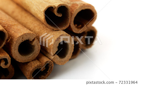 Cinnamon close up on a white background 72331964