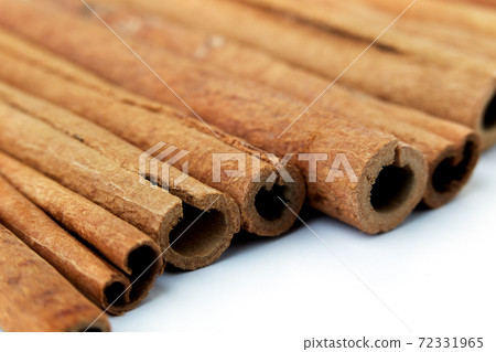 Cinnamon close up on a white background 72331965