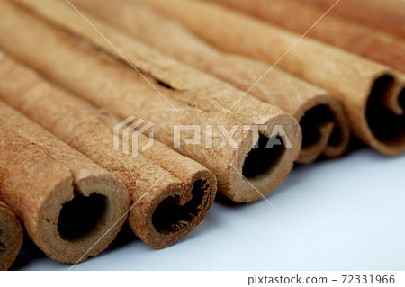 Cinnamon close up on a white background 72331966