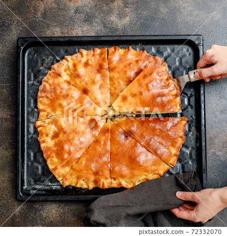 Cooked saury fish pie on a baking sheet, top view 72332070