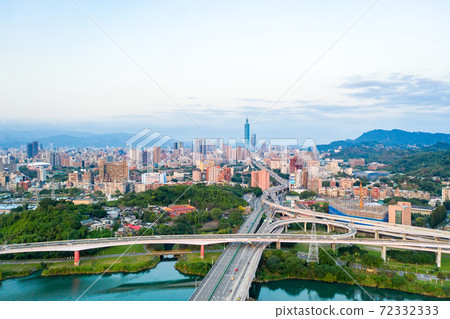 Asia business concept image, panoramic modern cityscape building birds eye view under sunrise and morning blue bright sky, shot in Taipei, Taiwan Asia business concept image, panoramic modern cityscape building birds eye view under sunrise and morning blue bright sky, shot in Taipei, Taiwan 72332333