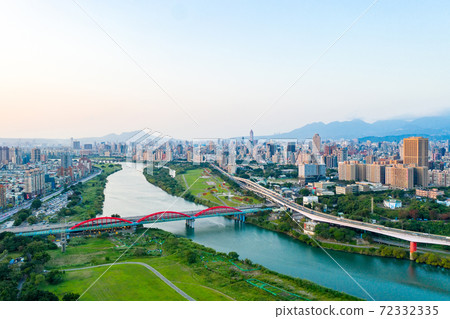 Asia business concept image, panoramic modern cityscape building birds eye view under sunrise and morning blue bright sky, shot in Taipei, Taiwan Asia business concept image, panoramic modern cityscape building birds eye view under sunrise and morning blue bright sky, shot in Taipei, Taiwan 72332335