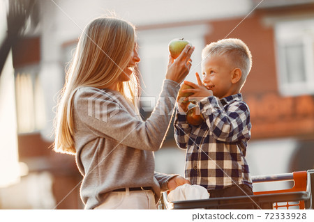 Mother with baby boy going shopping Mother with baby boy going shopping 72333928
