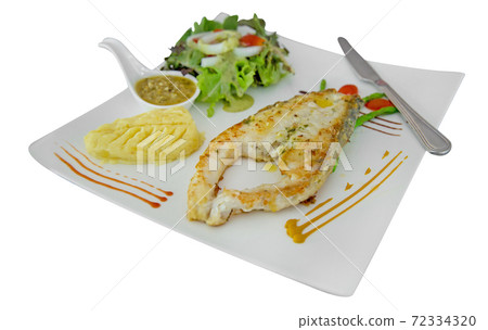 Sea Bass Steak with potato and mixed salad vegetable on white isolated. Sea Bass Steak with potato and mixed salad vegetable on white isolated. 72334320