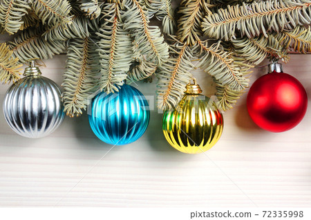 Christmas white wooden pattern with Christmas tree branches and toys Christmas white wooden pattern with Christmas tree branches and toys 72335998