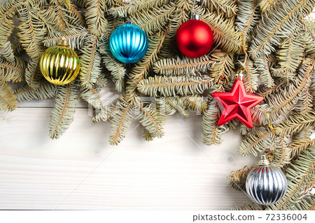 Christmas white wooden pattern with Christmas tree branches and toys Christmas white wooden pattern with Christmas tree branches and toys 72336004