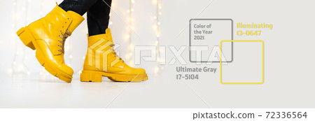Banner made of stylish yellow boots. Trendy colors of the year Banner made of stylish yellow boots. Trendy colors of the year 72336564