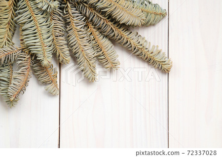 Christmas white wooden pattern with Christmas tree branches and toys Christmas white wooden pattern with Christmas tree branches and toys 72337028
