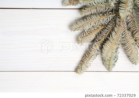 Christmas white wooden pattern with Christmas tree branches and toys Christmas white wooden pattern with Christmas tree branches and toys 72337029