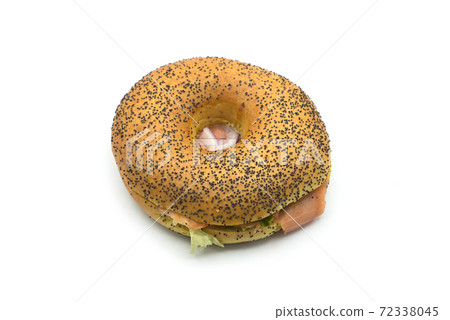 Closeup of donut sandwich with salad, onion and salmon on white background 72338045