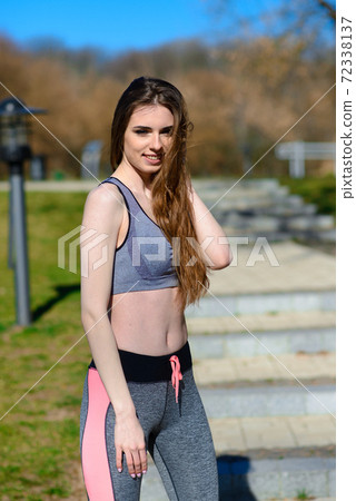 A close up of attractive young woman running 72338137