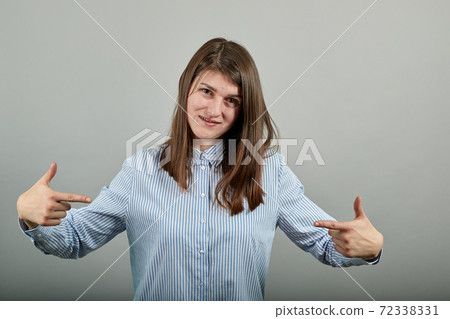 Pointing with hand at chest and staring. Shocked facial expression. Pointing with hand at chest and staring. Shocked facial expression. 72338331