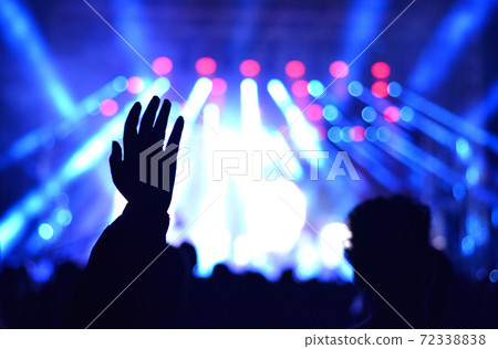 Raised hand at a live concert 72338838
