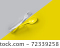 Plastic cup, fork, spoon on color 2021 72339258