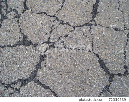 Asphalt road with repaired cracks Asphalt road with repaired cracks 72339389