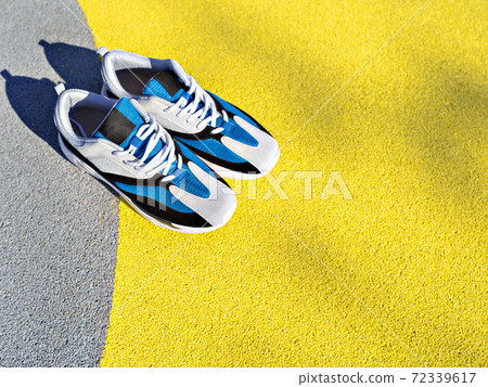 Sport shoes on Illuminating yellow and grey. Sport shoes on Illuminating yellow and grey. 72339617