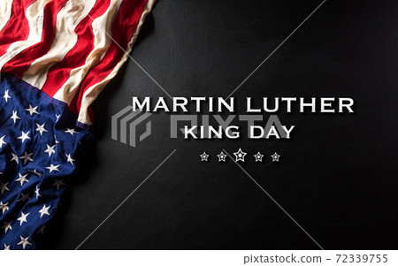 Martin Luther King Day celebrated concept. American flag against wooden background 72339755