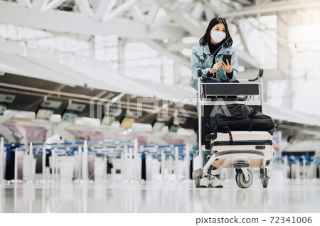 Asian woman traveler wearing mask 72341006