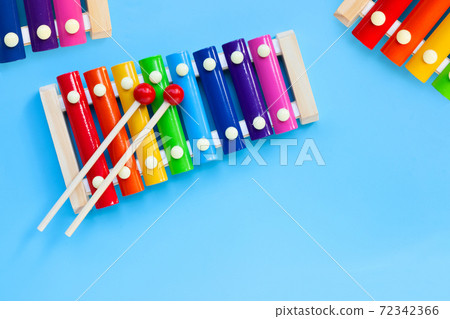 Colorful xylophone on blue background. Colorful xylophone on blue background. 72342366