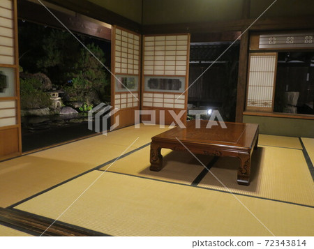 Japanese-style room in Japanese house and garden at night 72343814