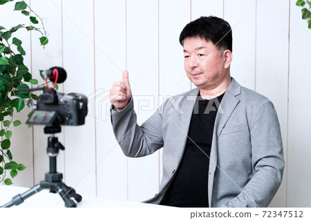 Men shooting a video Men shooting a video 72347512