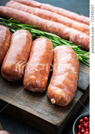 Homemade raw pork sausages, on black background 72348267