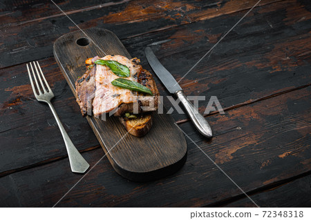 Liver bacon and onions on bread cooked meal served on board, over wooden background with copy space Liver bacon and onions on bread cooked meal served on board, over wooden background with copy space 72348318