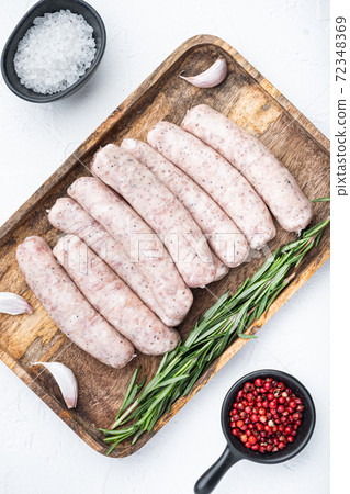Traditional raw sausages, flat lay, on white background Traditional raw sausages, flat lay, on white background 72348369