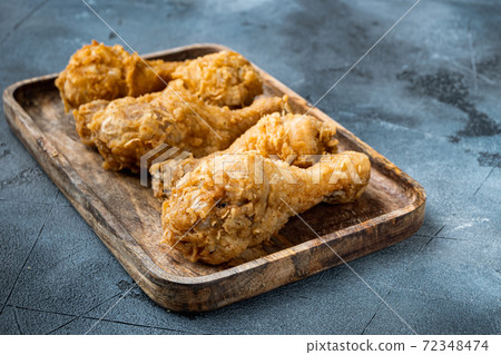 Crispy fried chicken on grey background Crispy fried chicken on grey background 72348474