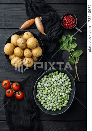 Mashed potatoes ingredients with green pea and mint, flat lay, on black wooden background Mashed potatoes ingredients with green pea and mint, flat lay, on black wooden background 72348672