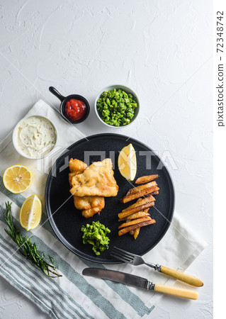 fish chips with beer-battered cod and fries and a 72348742