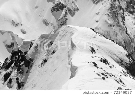 Snow cornice in high winter mountains in nice sun day 72349057