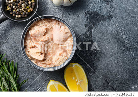 canned tuna open can with fresh herbs garlic and 72349135