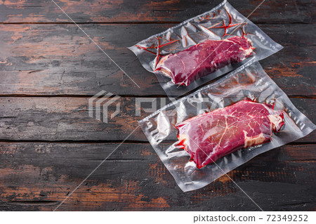 Vacuum packed Rump Steak from organic beef on dark Vacuum packed Rump Steak from organic beef on dark 72349252