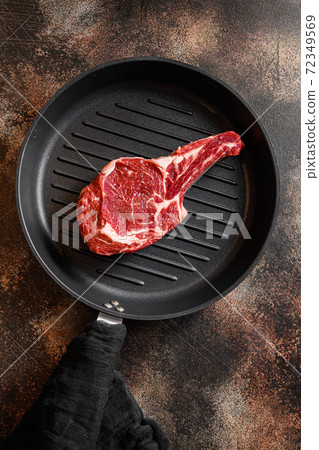 Bone In Steak on the grill pan skillet or Dallas 72349569