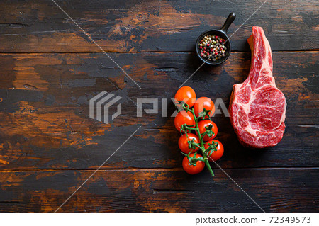 Dallas beef steak, and spices with tomatoes on a 72349573
