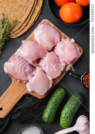 Burrito ingredients, chicken thigh on black 72350557