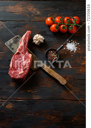 Raw Beef Rib Steak on meat cleaver. Organic farm 72350616