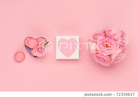 Flowers roses, gift box and sweets macaroons on pink background. Valentines day concept. Flat lay, top view, copy space. 72350617