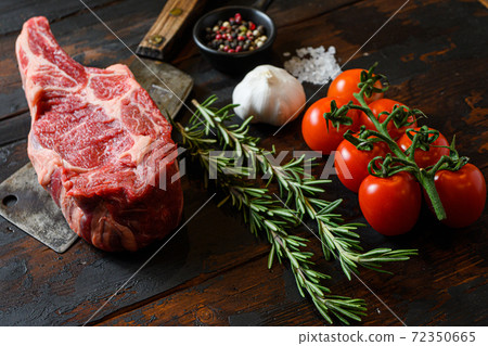 Raw Cowboy steak on meat cleaver. Organic farm 72350665