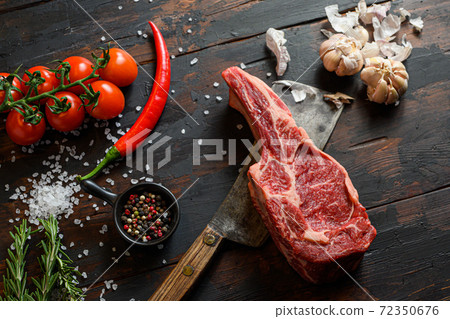 Raw dry Delmonico steak on dark wooden vintage 72350676